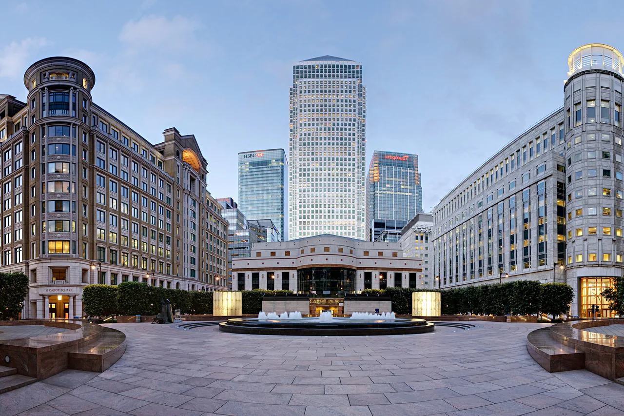 The fountain and towers of Cabot Square at Canary Wharf on a bright day