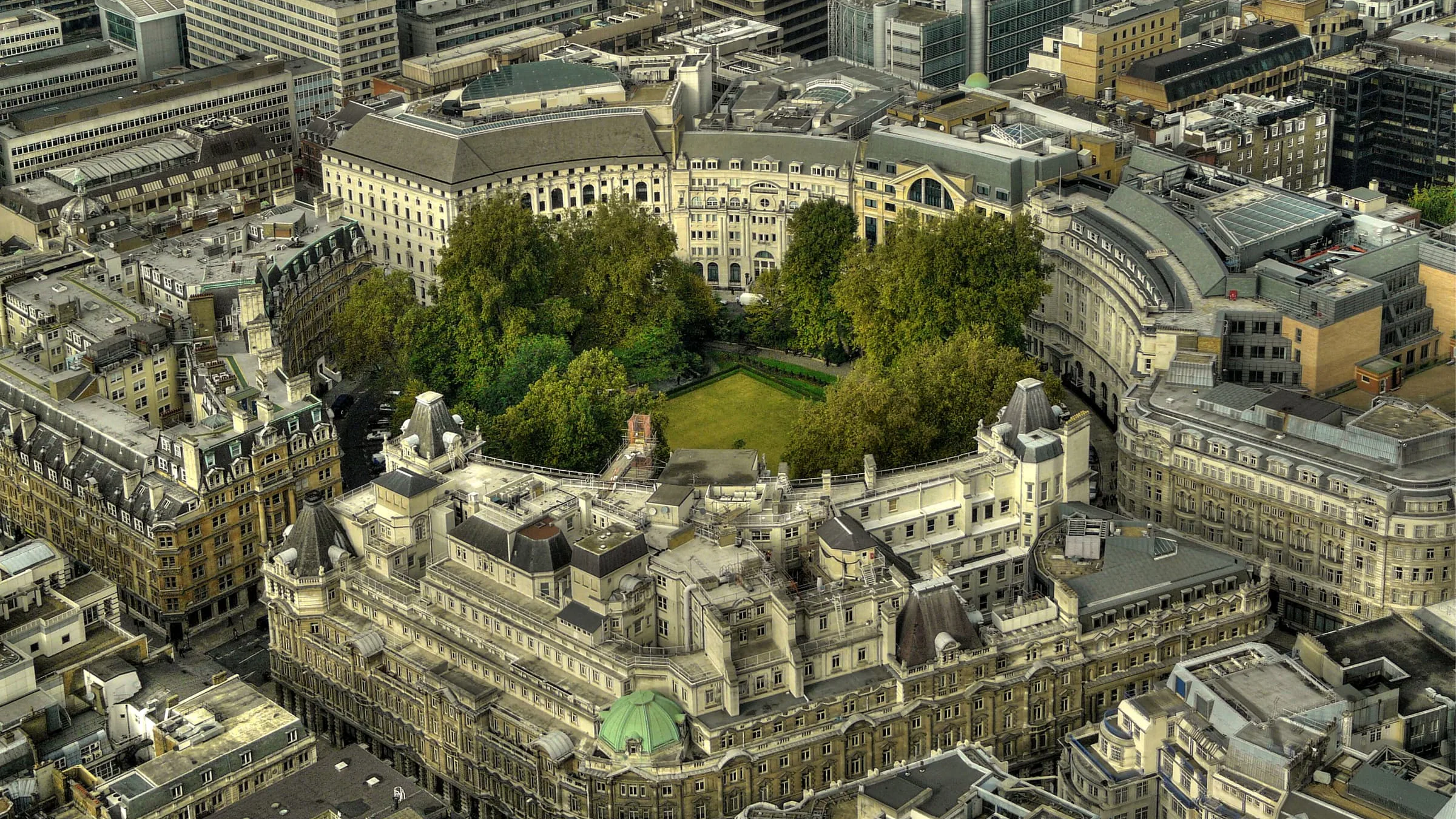 The oval garden of Finsbury Circus in the City of London seen from above, ringed by offices