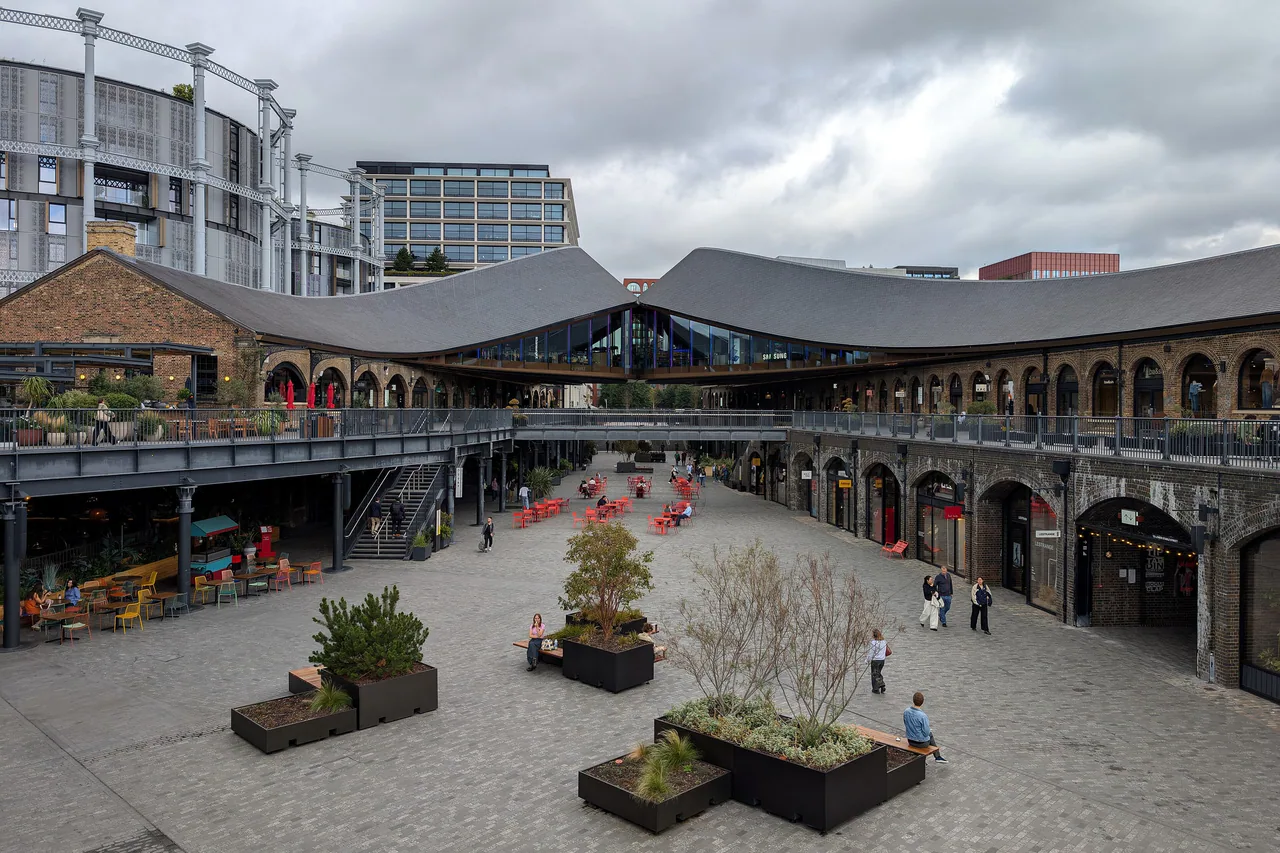 The brick viaducts and kissing roofs of Coal Drops Yard at King's Cross from the south