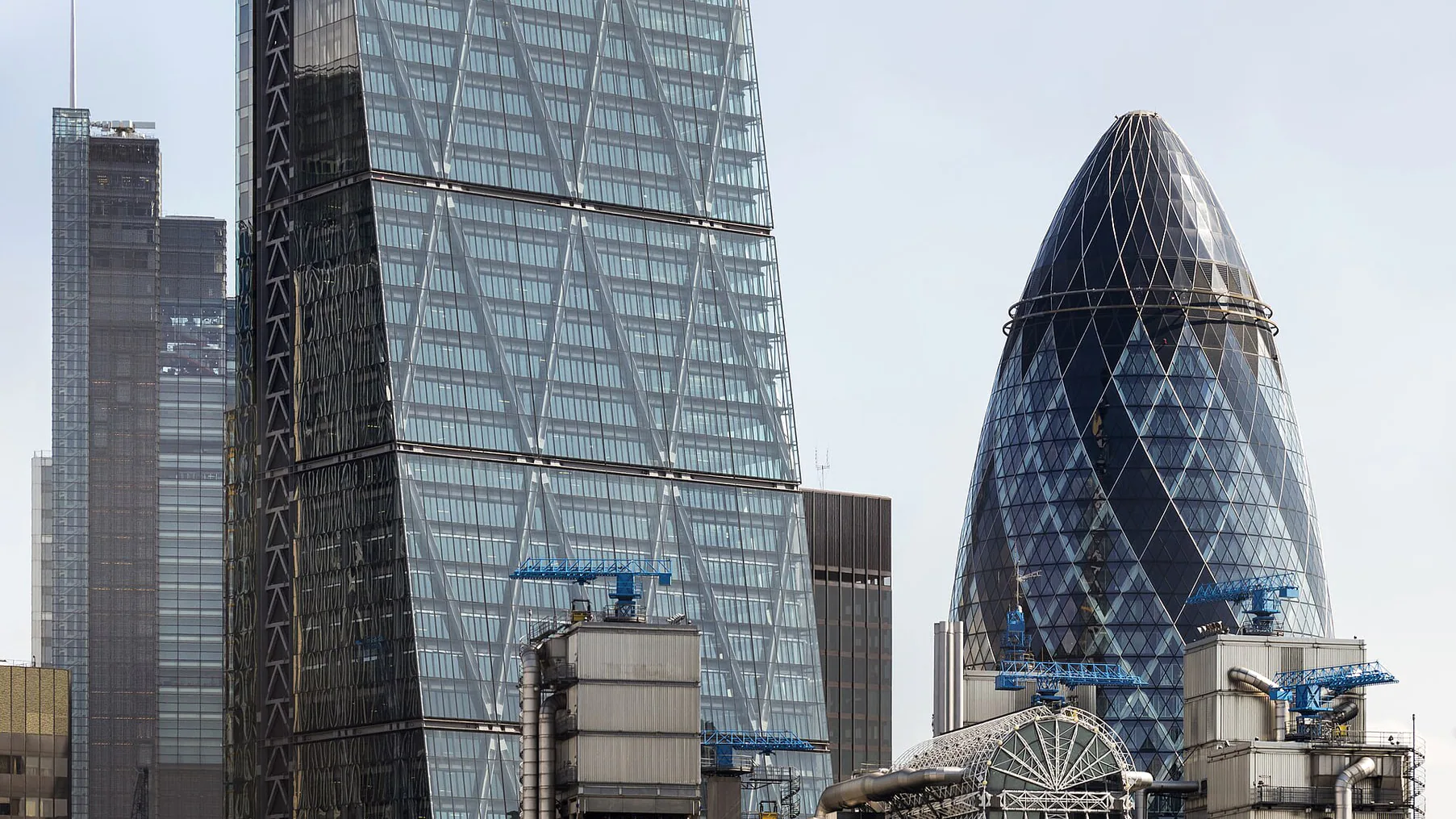 The Leadenhall Building and the Gherkin side by side against the sky